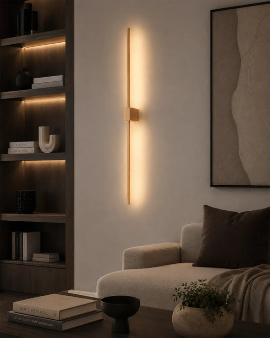 Double Lines Gold Square Wall Lamp in a styled interior, wall lamp with two parallel geometric lines (view 1) | أبليك دبل لاينز سكوير الذهبي، داخل مساحة منسقة، إضاءة خلفية بخطين هندسيين