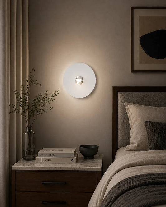 Troika Wall Lamp in a styled interior, wall lamp with a considered grouping of circular forms (view 1) | أبليك ترويكا، داخل مساحة منسقة، قرص دائري