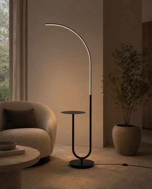 Curve Floor Lamp in a styled interior, floor lamp with a gentle curving line (view 1) | لمبادير كيرف، داخل مساحة منسقة، قوس مضيء بغطاء أكريليك
