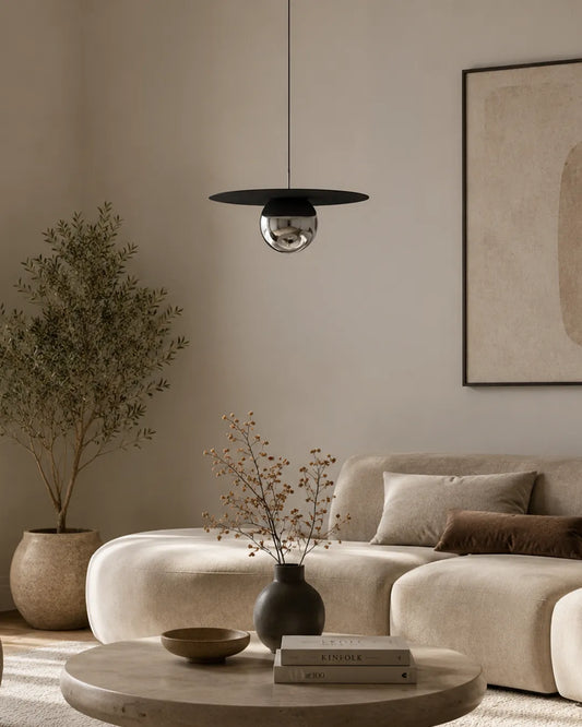 Troika Pendant isolated product view in black, pendant with a considered grouping of circular forms | دلاية ترويكا، بتشطيب أسود، قرص وكرة مضيئة
