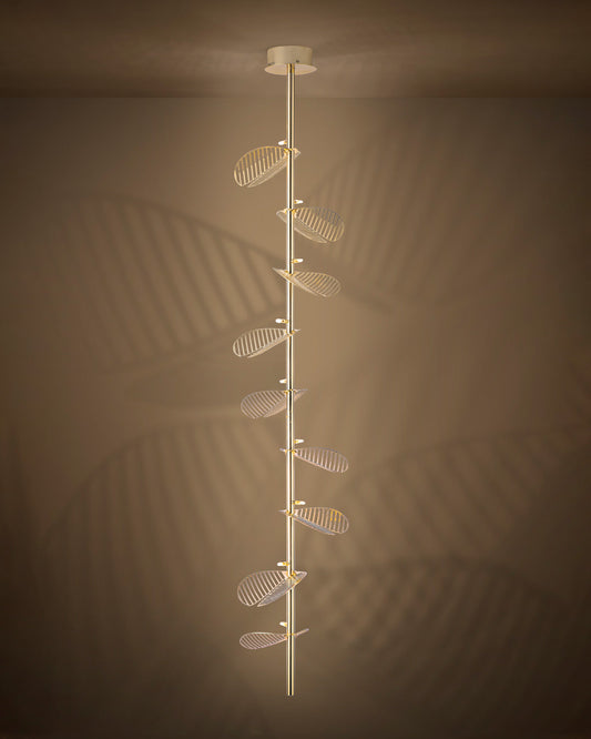 Serenity pendant light with single branch leaf inspired design emitting warm ambient light / إضاءة معلقة بتصميم مستوحى من غصن طبيعي وأوراق ناعمة توفّر إضاءة دافئة ومريحة