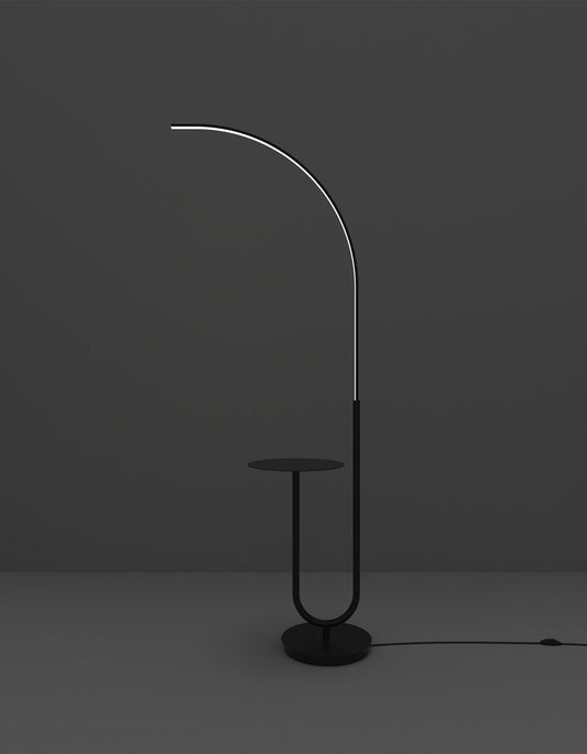 Curve floor lamp with sleek curved silhouette providing soft ambient lighting – مصباح كورف أرضي بتصميم منحني أنيق يمنح إضاءة محيطية ناعمة
