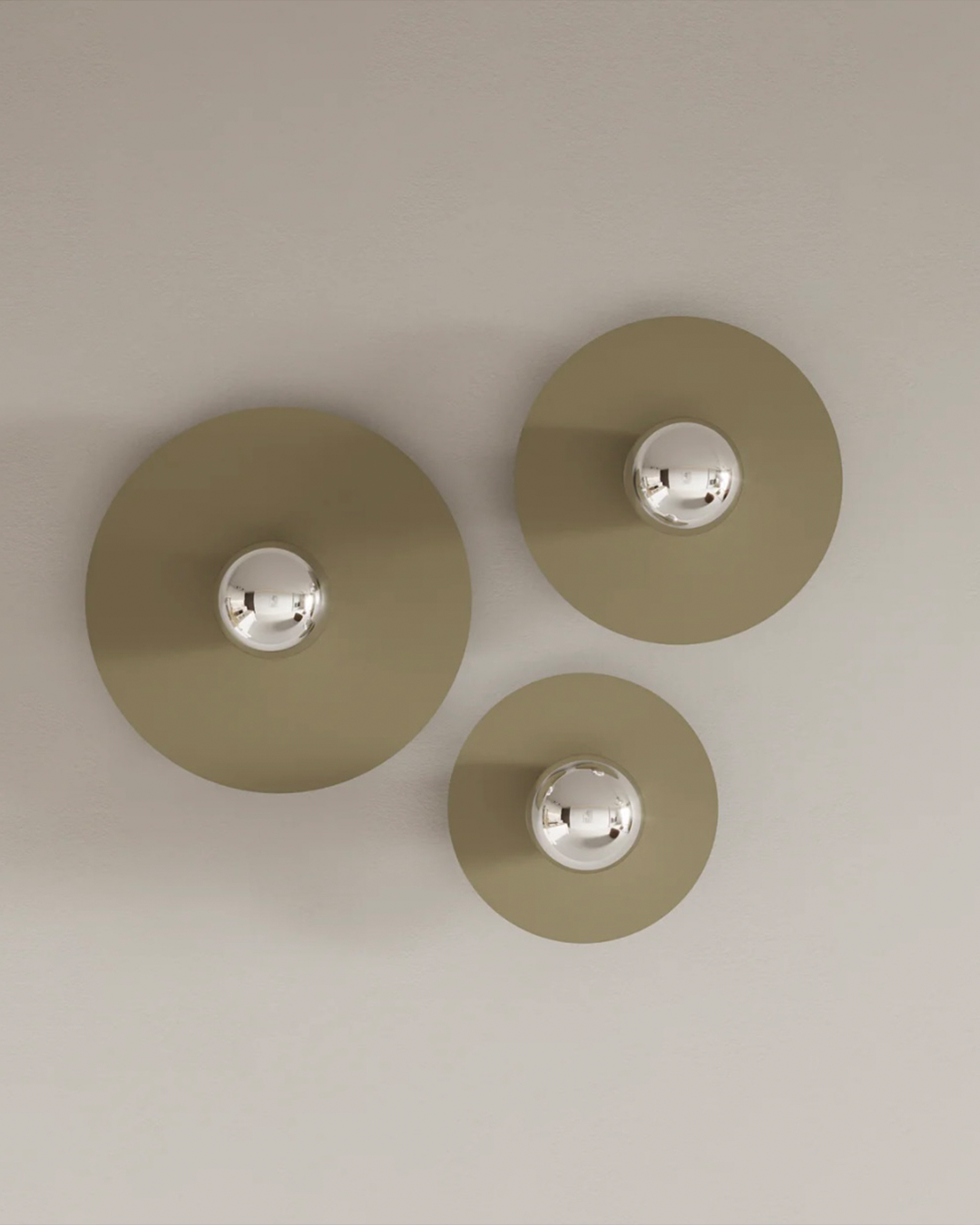 Troika wall lamp with three harmonious elements creating warm decorative glow مصباح جداري ترويكا بثلاثة عناصر متناغمة تضفي توهجاً زخرفياً دافئاً