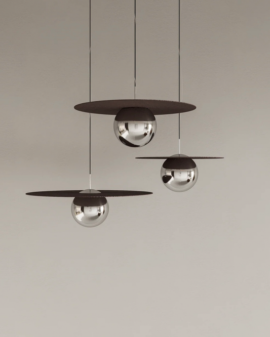 Troika pendant light with three decorative hanging elements creating ambient glow مصباح معلق ترويكا بثلاثة عناصر زخرفية مضيئة بتوهج محيطي