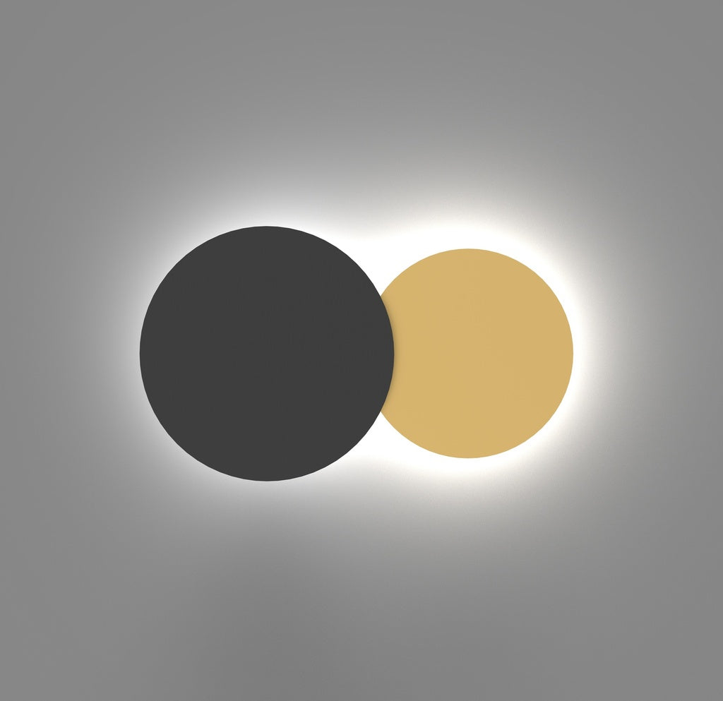 Twin Wall Lamp — overlapping black and gold circles with backlighting | أبليك توين، دائرتان متداخلتان بالأسود والذهبي وإضاءة خلفية