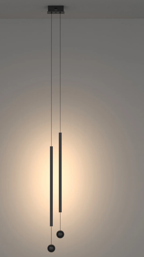 Two Lines Pendant — two slim black suspended lights | دلاية تو لاينز، خطّان أسودان معلقان بإضاءة دافئة