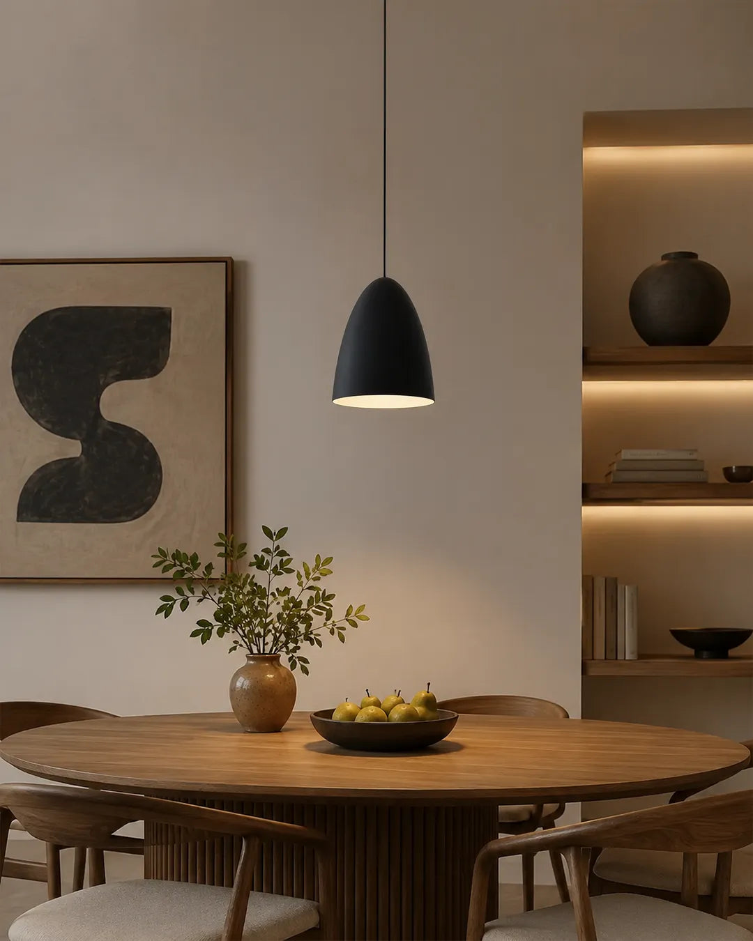 Miko Pendant in a styled interior, pendant with forms held in apparent balance | دلاية ميكو، داخل مساحة منسقة، تكوين متوازن مضيء