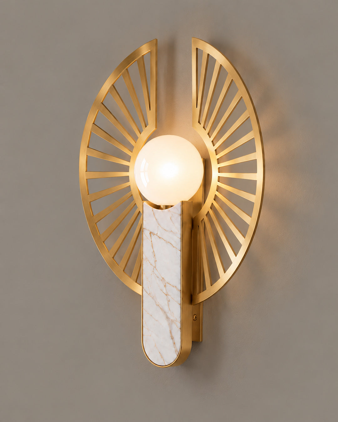 Solaris Wall Lamp with a golden sunburst frame, light globe and veined backplate | أبليك سولاريس بدائرة ذهبية وكرة مضيئة وخلفية طولية بعروق فاتحة