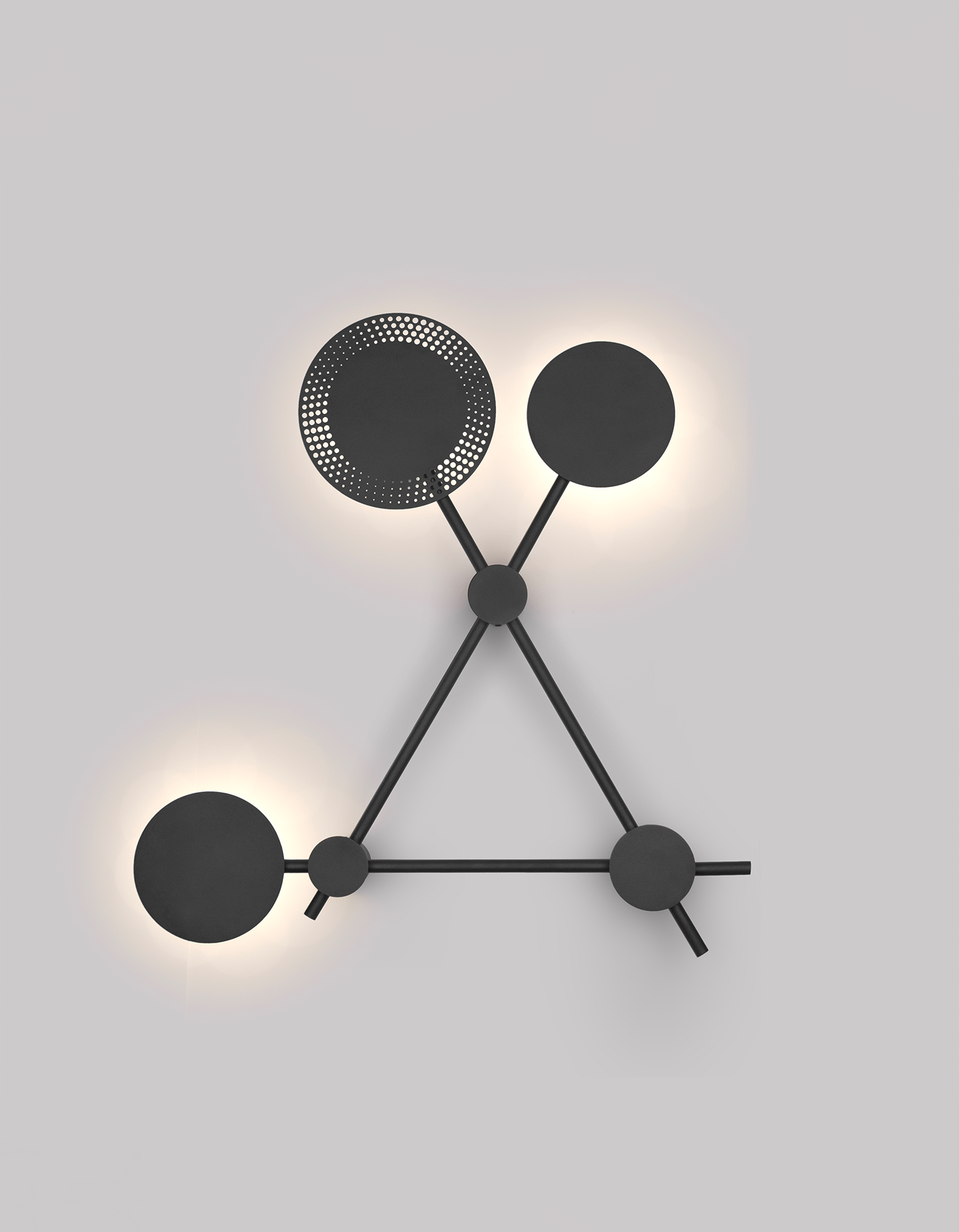 Trio wall lamp with three circular elements creating soft ambient light / مصباح حائط بثلاث دوائر متناسقة يبعث إضاءة ناعمة بطابع عصري