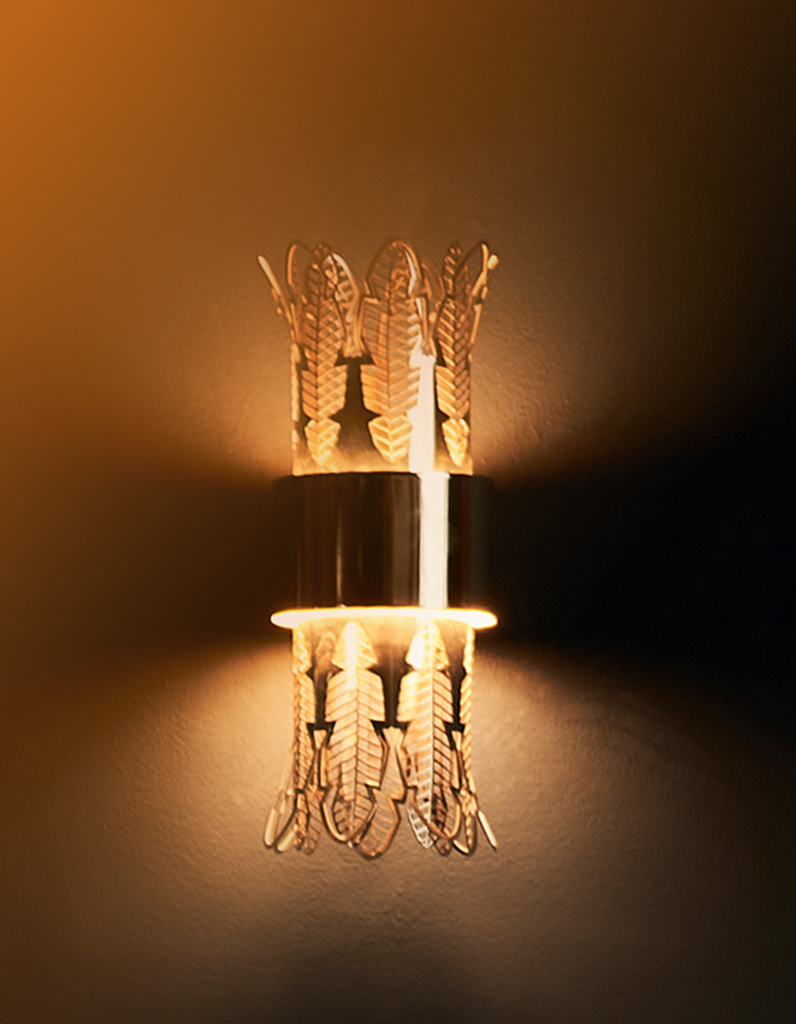 Leaf wall lamp with ancient Egyptian inspired sculptural design casting soft light / مصباح حائط بتصميم مستوحى من الأعمدة المصرية القديمة يبعث إضاءة ناعمة