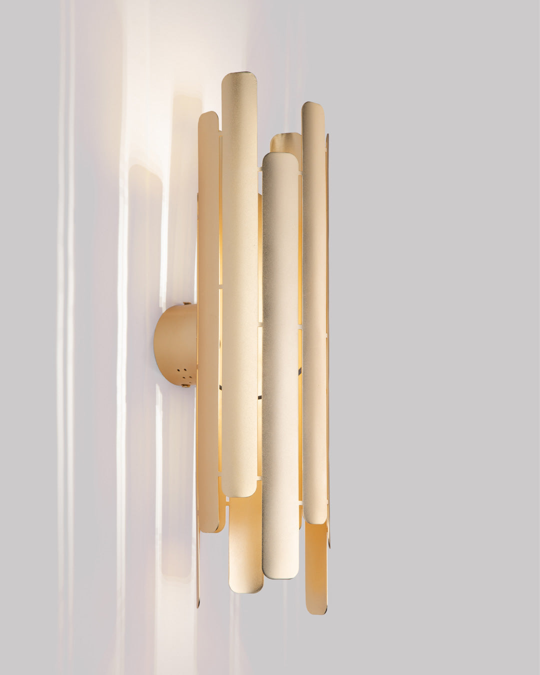 Tempo wall lamp with rhythmic sculptural design casting soft indirect light / مصباح حائط بتصميم إيقاعي نحتي يبعث إضاءة غير مباشرة ناعمة