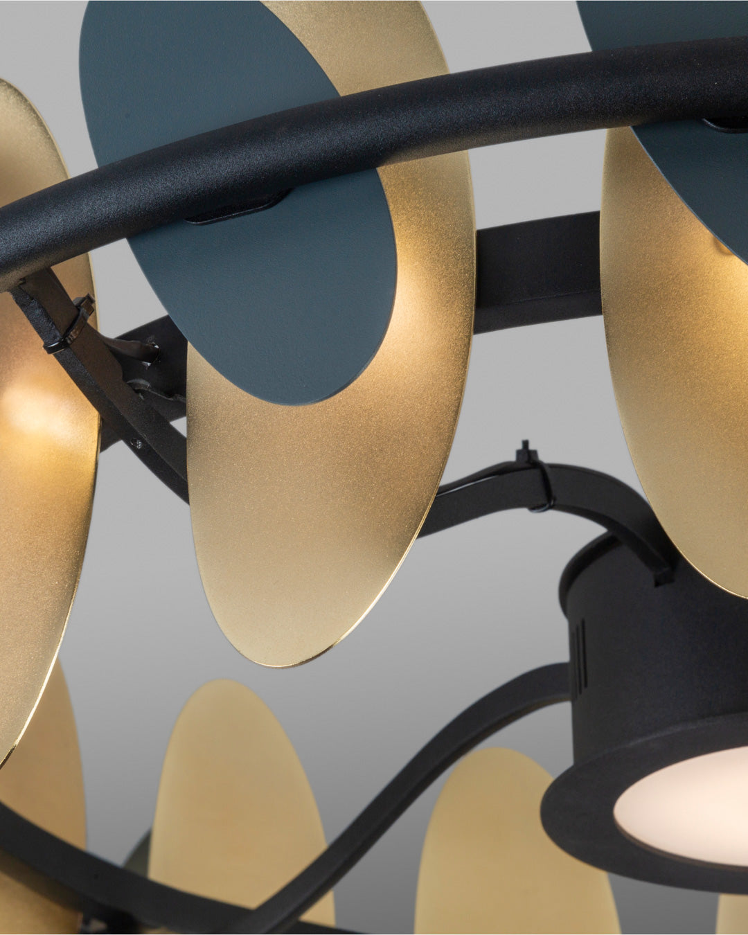 Oval pendant light with butterfly wing inspired form casting soft ambient light / إضاءة معلقة بتصميم بيضاوي مستوحى من أجنحة الفراشة تبعث إضاءة ناعمة