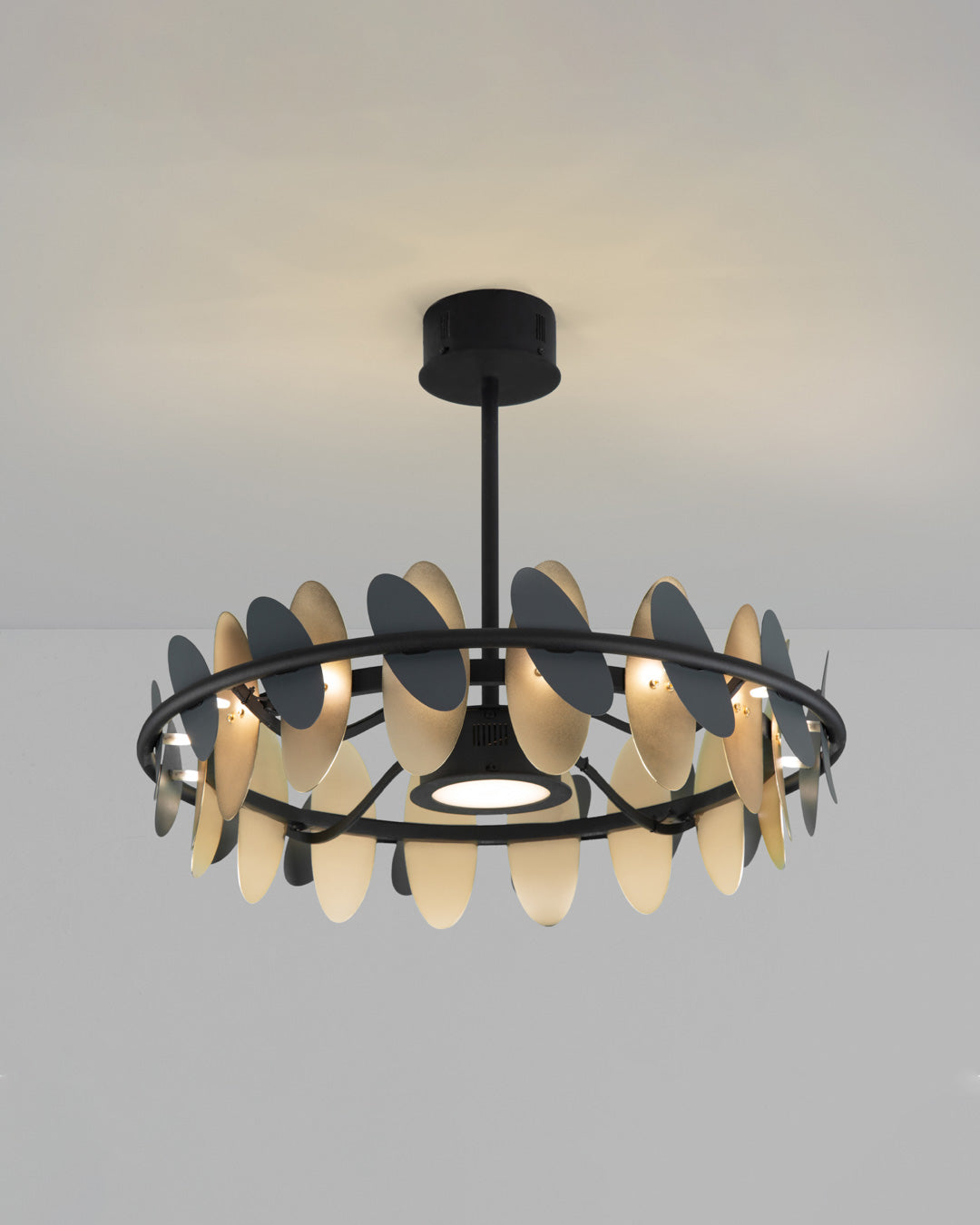Oval pendant light with butterfly wing inspired form casting soft ambient light / إضاءة معلقة بتصميم بيضاوي مستوحى من أجنحة الفراشة تبعث إضاءة ناعمة