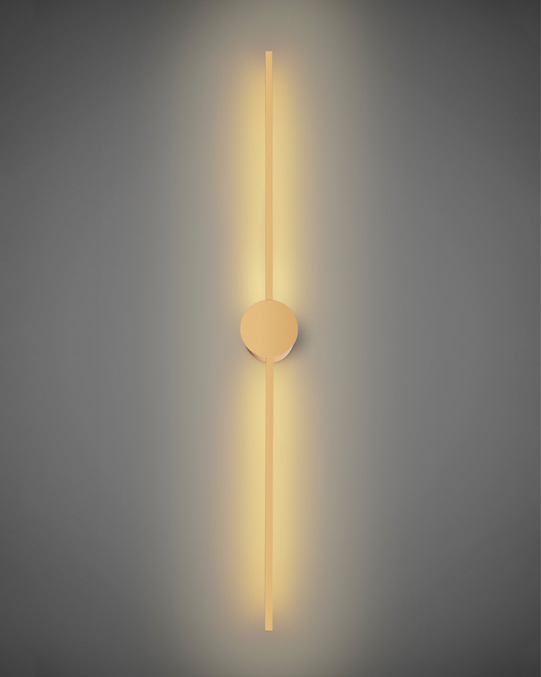 Gold wall lamp with double vertical lines and central circle casting soft indirect light / مصباح حائط ذهبي بخطين رأسيين ودائرة مركزية يبعث إضاءة غير مباشرة ناعمة