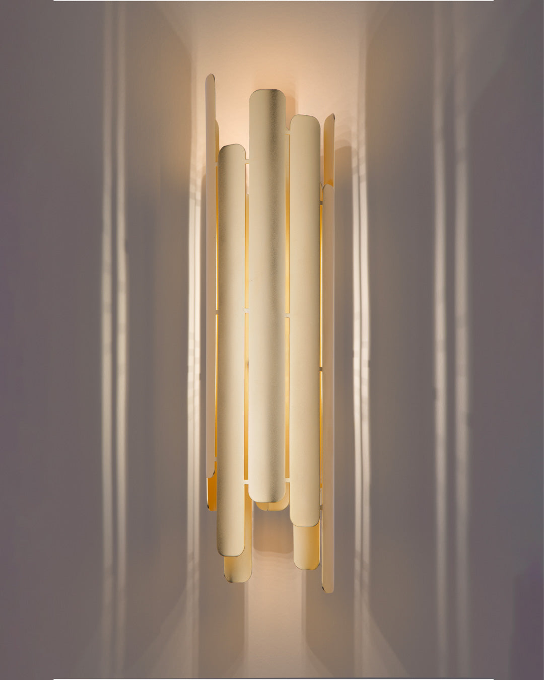 Tempo wall lamp with rhythmic sculptural design casting soft indirect light / مصباح حائط بتصميم إيقاعي نحتي يبعث إضاءة غير مباشرة ناعمة