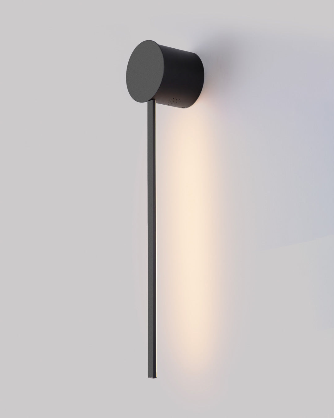 Black wall lamp with linear lines and circular element creating soft indirect light / مصباح حائط أسود بخطوط هندسية ودائرة يبعث إضاءة غير مباشرة ناعمة