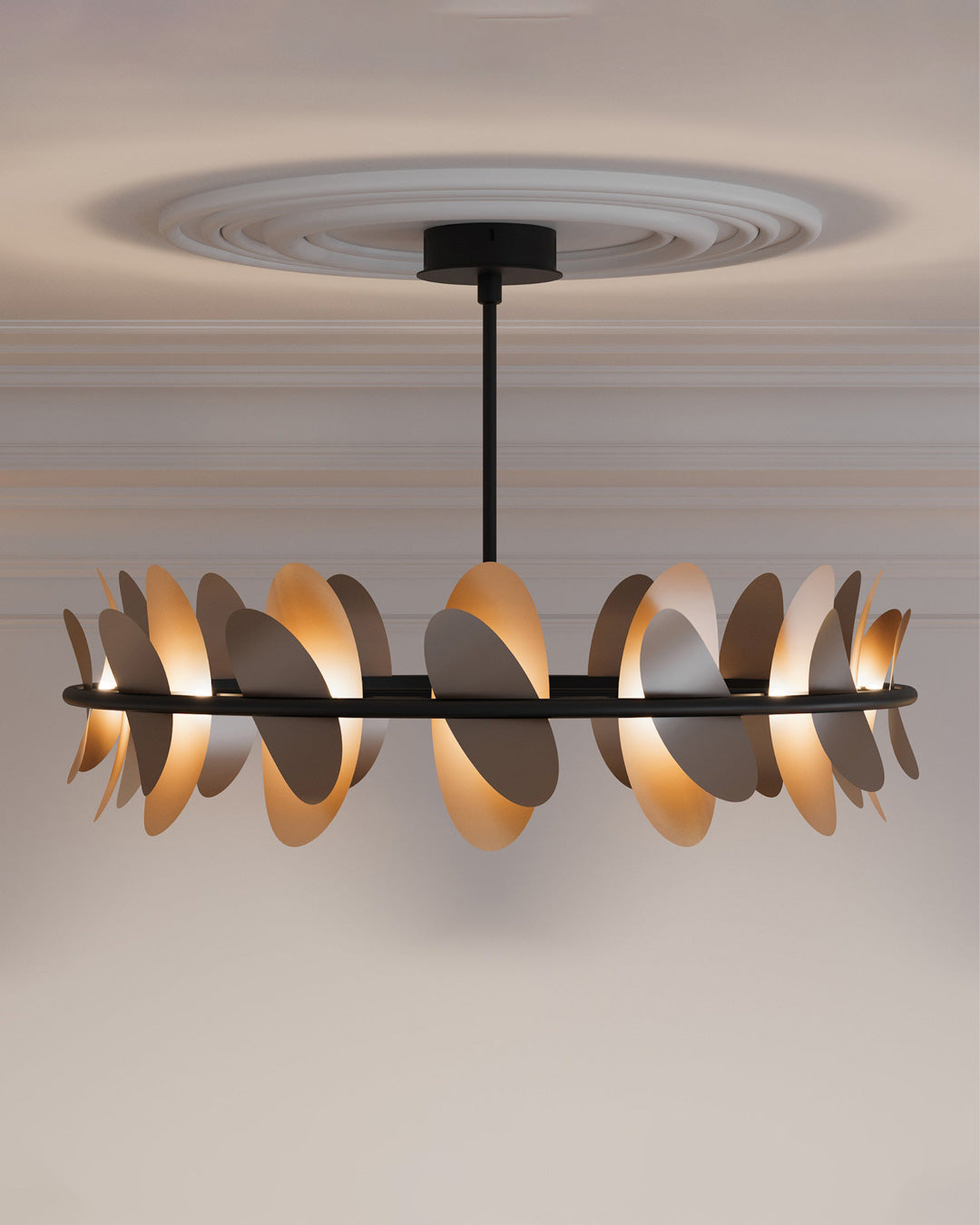 Oval pendant light with butterfly wing inspired form casting soft ambient light / إضاءة معلقة بتصميم بيضاوي مستوحى من أجنحة الفراشة تبعث إضاءة ناعمة