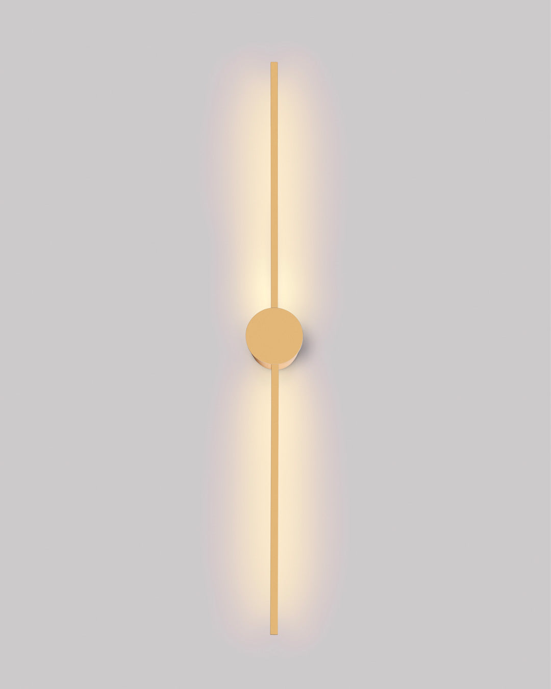 Gold wall lamp with double vertical lines and central circle casting soft indirect light / مصباح حائط ذهبي بخطين رأسيين ودائرة مركزية يبعث إضاءة غير مباشرة ناعمة