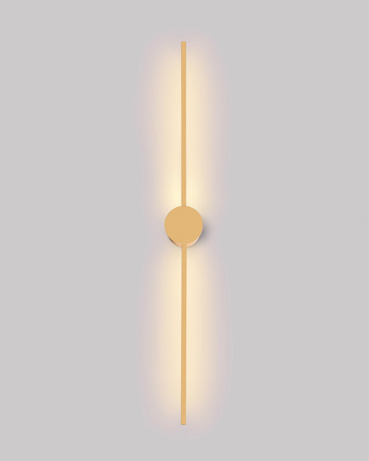 Gold wall lamp with double vertical lines and central circle casting soft indirect light / مصباح حائط ذهبي بخطين رأسيين ودائرة مركزية يبعث إضاءة غير مباشرة ناعمة