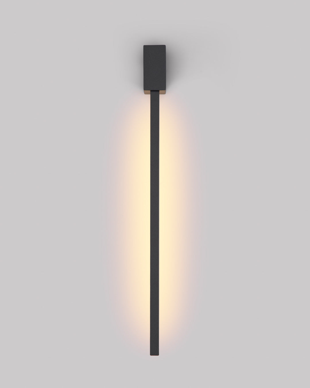 Black square wall lamp with linear design casting soft indirect light / مصباح حائط أسود مربع بخطوط هندسية يبعث إضاءة غير مباشرة ناعمة