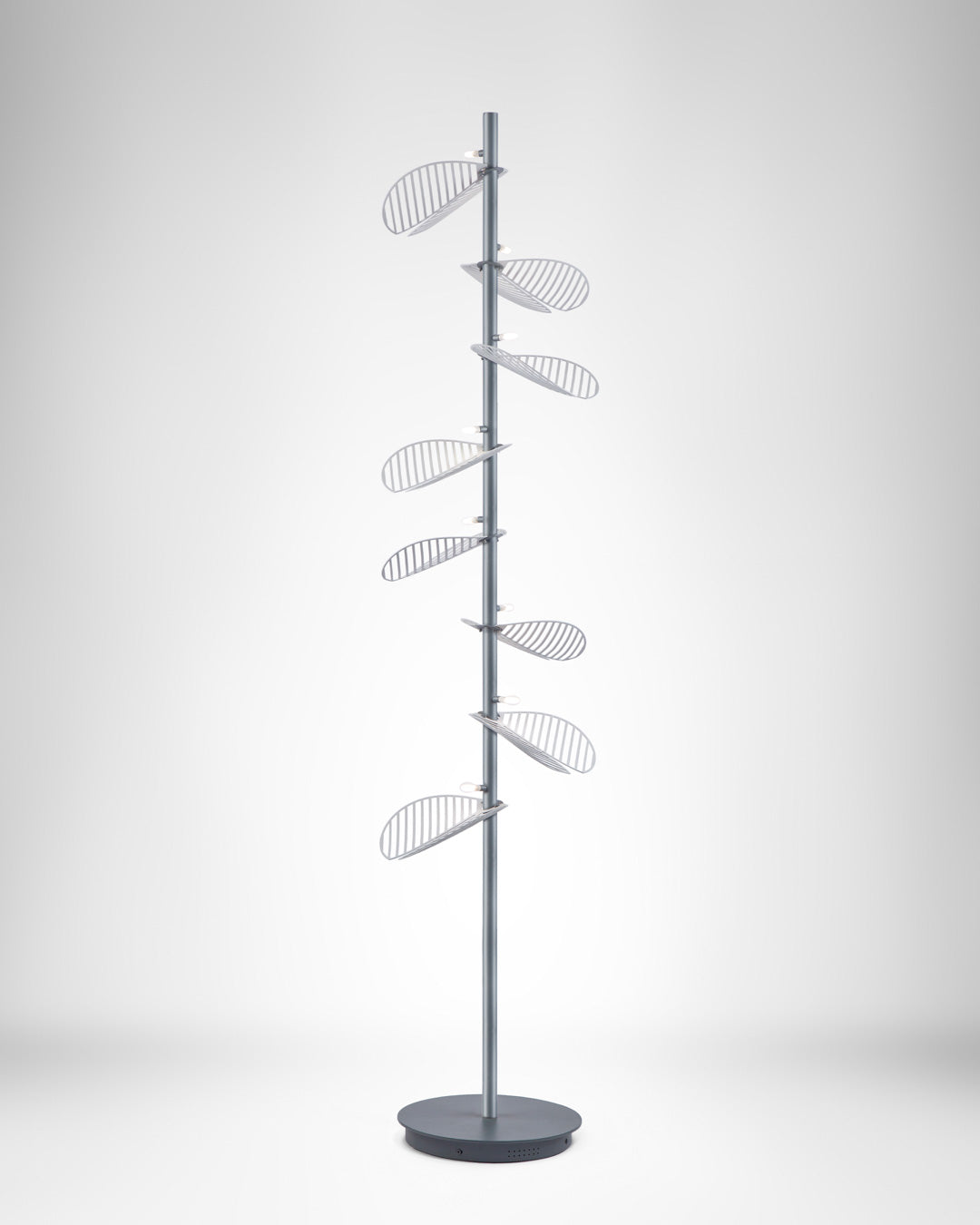 Serenity floor lamp with leaf inspired sculptural design casting warm ambient light / مصباح أرضي بتصميم مستوحى من الأوراق الطبيعية يوفّر إضاءة دافئة وهادئة