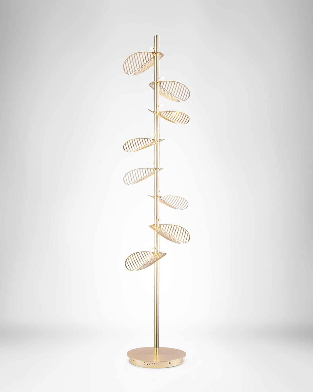 Serenity floor lamp with leaf inspired sculptural design casting warm ambient light / مصباح أرضي بتصميم مستوحى من الأوراق الطبيعية يوفّر إضاءة دافئة وهادئة