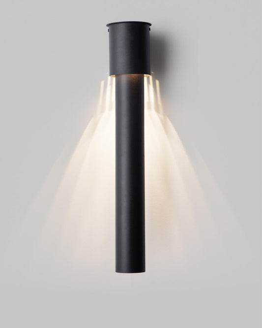 Dew inspired wall lamp with soft glowing glass form on a modern wall / مصباح حائط بتصميم مستوحى من قطرات الندى يبعث إضاءة ناعمة على الجدار