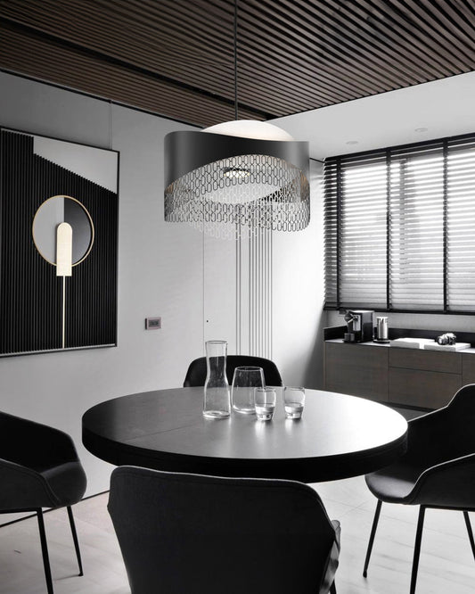 Chains pendant light with interconnected sculptural elements creating dramatic ambient lighting / إضاءة معلقة بعناصر مترابطة بتصميم فني تخلق إضاءة محيطية جريئة