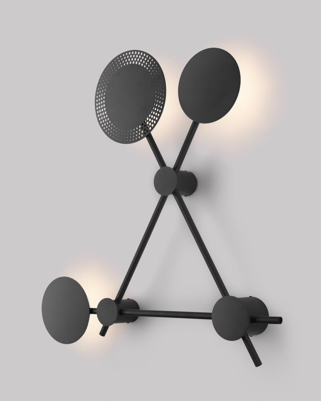 Trio wall lamp with three circular elements creating soft ambient light / مصباح حائط بثلاث دوائر متناسقة يبعث إضاءة ناعمة بطابع عصري