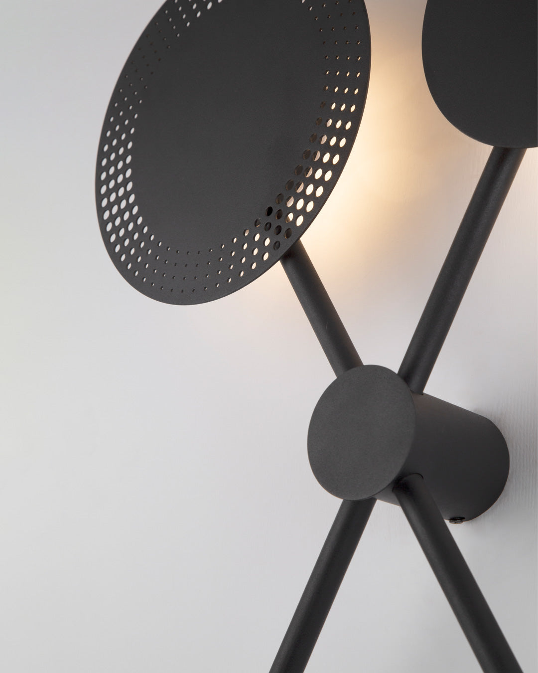 Trio wall lamp with three circular elements creating soft ambient light / مصباح حائط بثلاث دوائر متناسقة يبعث إضاءة ناعمة بطابع عصري