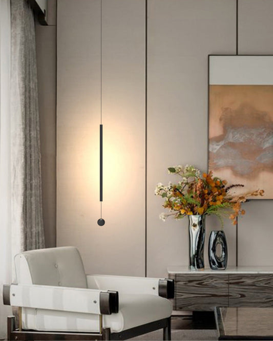 Lines pendant light with slim vertical black design creating warm ambient lighting / إضاءة معلقة بتصميم خطي نحيف باللون الأسود تضيف إضاءة دافئة ولمسة عصرية