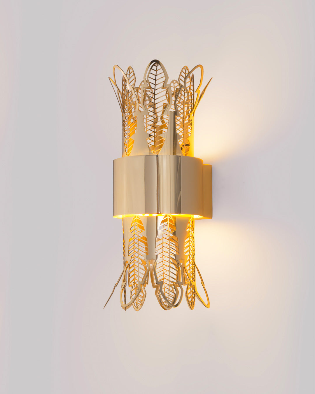 Leaf wall lamp with ancient Egyptian inspired sculptural design casting soft light / مصباح حائط بتصميم مستوحى من الأعمدة المصرية القديمة يبعث إضاءة ناعمة